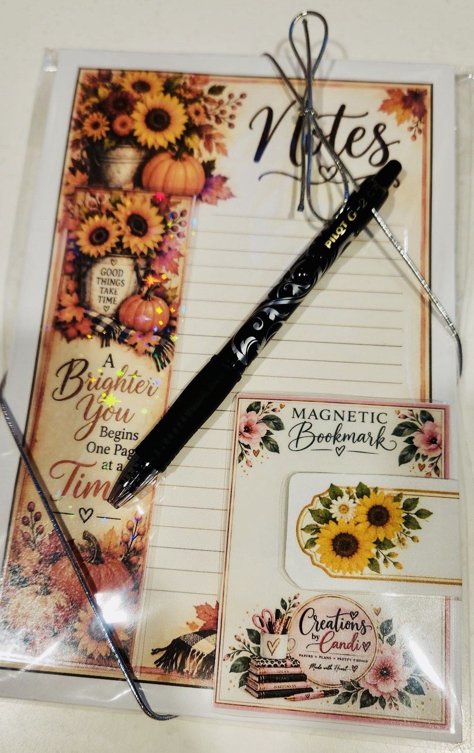 Finished autumn stationery package with clear wrapping, silver ribbon, pen and coordinated bookmarks